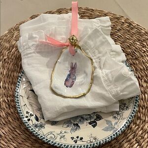 Hand-Painted Bunny Shell Ornament with Pink Ribbon.